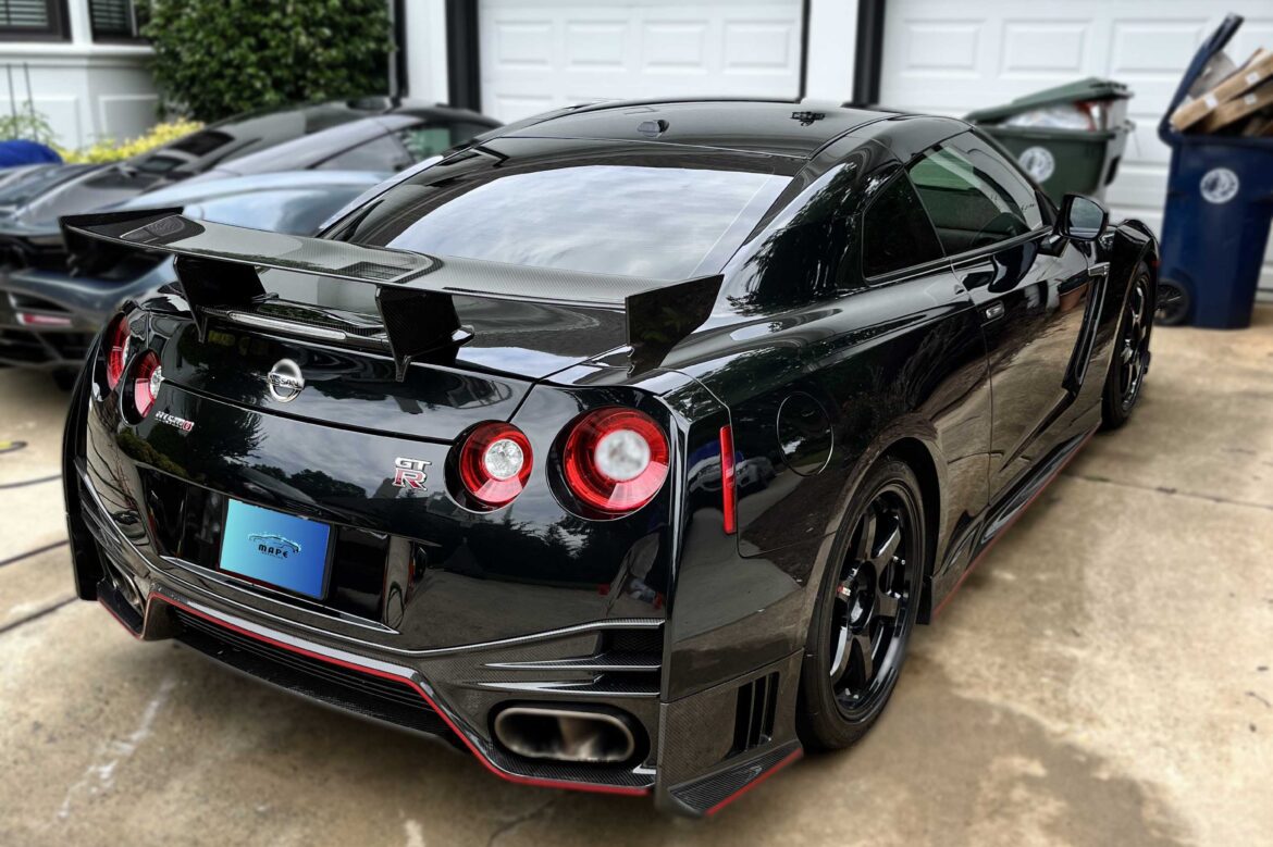 Back view of a meticulously detailed Nissan GTR, showcasing its sleek design and impressive performance.